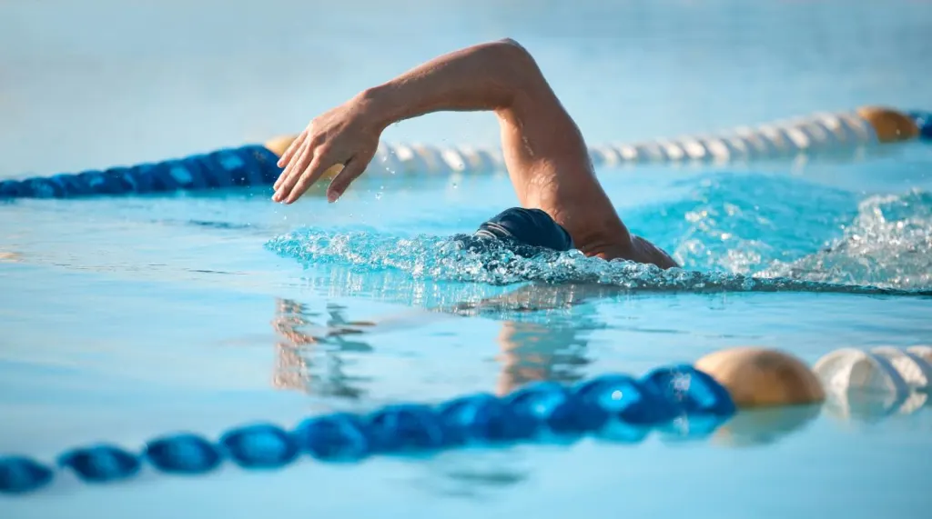 Man swimming laps in pool